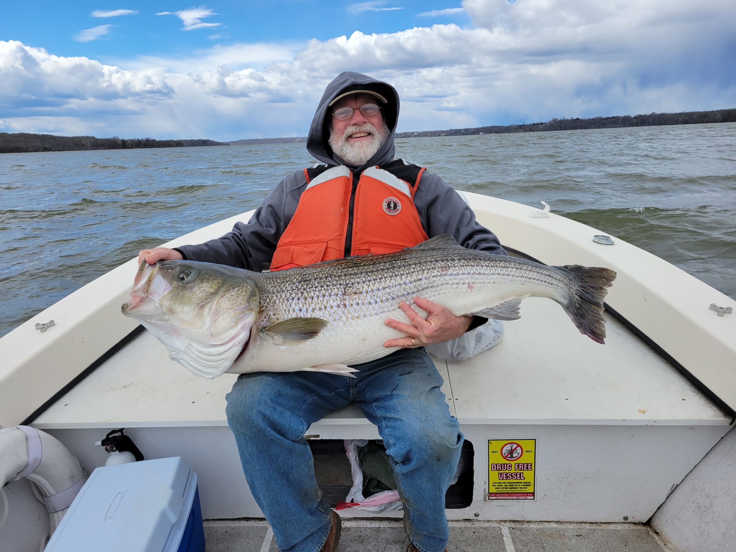 https://indianheadcharters.com/wp-content/uploads/2022/03/Gary-with-monster-striper-scaled.jpg